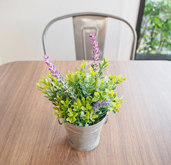 A bouquet of artificial flowers on the table