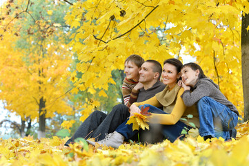 Family sitting on grass 