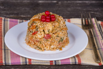 Chicken meat with vegetables and rice in curry sauce
