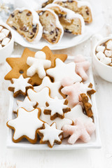 Fototapeta na wymiar assortment gingerbread cookies, Christmas Stollen and cocoa