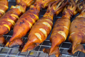 Grilled squid on the market in Thailand