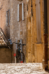 Bicycle on a street of an old town in the Southern Europe