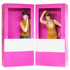 Boy and girl looking like dolls in boxes