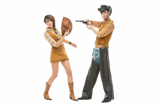 Cowboy and cowgirl with gun
