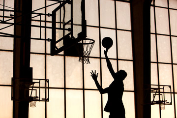 Basketball player slams it