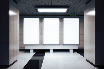 Blank white banners on the wall in empty subway hall, mock up