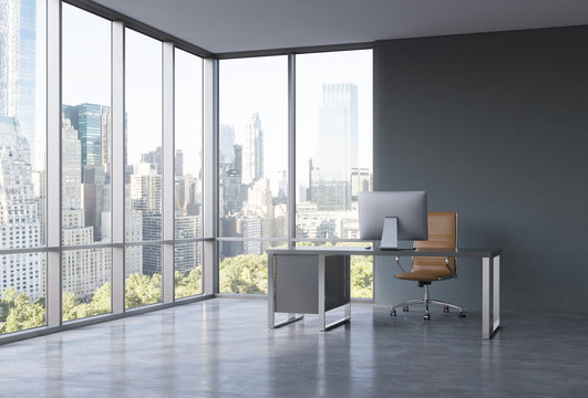 A workplace in a modern corner panoramic office with New York view. A black desk with a modern computer and brown leather chair. A concept of consulting services. 3D rendering.