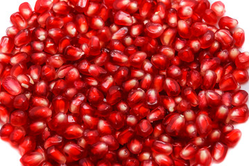 pomegranate seeds on white