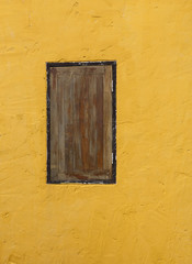  Yellow wall and wooden window