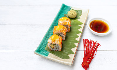 Fototapeta na wymiar Japanese style sushi with space on wood floor