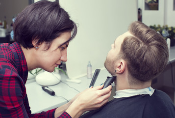 Obraz na płótnie Canvas men's haircut in the salon barbershop beard closeup