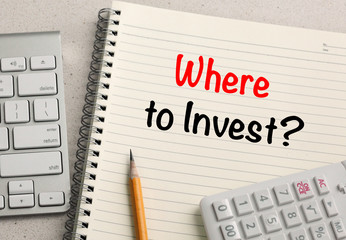 concept of where to invest with notebook and calculator