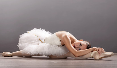  Ballerina is wearing a white tutu and pointe shoes