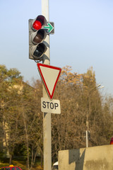 Red traffic light, Stop sign at intersection