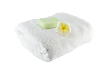 Spa treatment with soap towels and flower on white background
