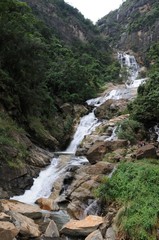 Obraz na płótnie Canvas Waterfall in deep forest near Nuwara Eliya in Sri Lanka.