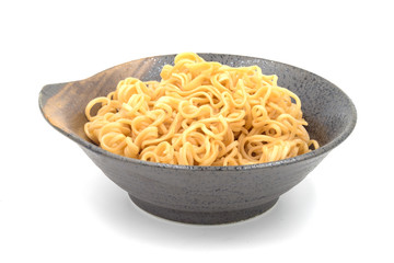 Noodle in ceramic bowl on white background.