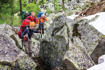 Young people are hiking in highlands of Altai mountains, Russia