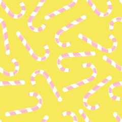 Vector seamless pattern with christmas candies on yellow background