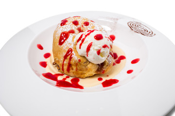 Cinnamon bun with ice cream.