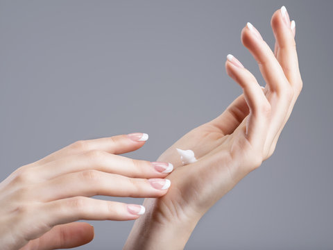 Close-up Female Hands Apllying Hand Cream