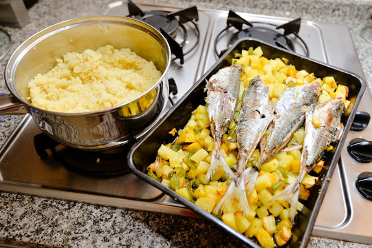 Tasty cuscus in pot and baked makrels with sweet potatoes