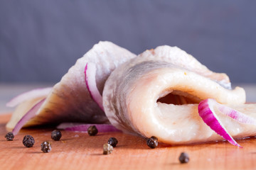 Pieces of herring fillet on a cutting board