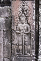 Cambodiastyle door with a guardians  carvings status on the wall