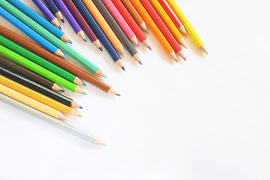 Closeup of Colour pencils on white background, selective focus