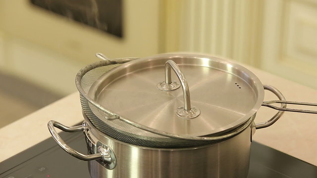 Hot steamer pan on a kitchen stove