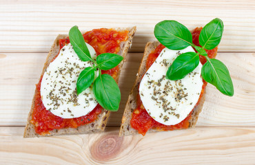 Italian bruschetta with cherry tomatoes, mozzarella & fresh basil.