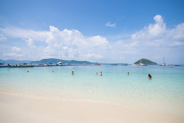 Tourists enjoy swimming at the coral island