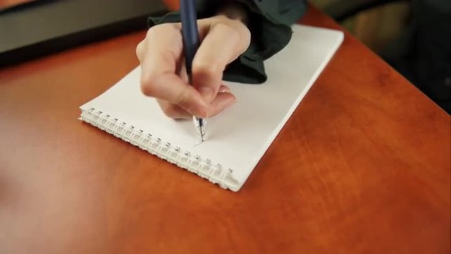 woman writing to do list 