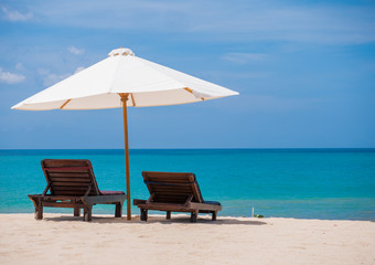 Beach chairs with umbrella and beautiful beach