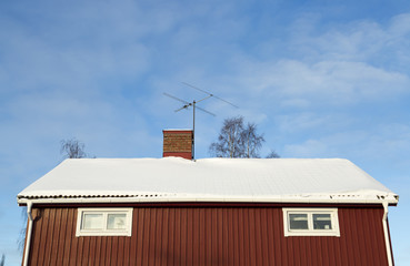 Red House With Snow on the Roof