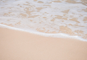 Fototapeta na wymiar Waves on the sandy beach