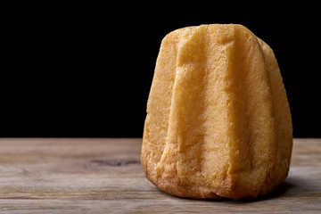 pandoro cake on wood on black background traditional christmas dessert in Italy