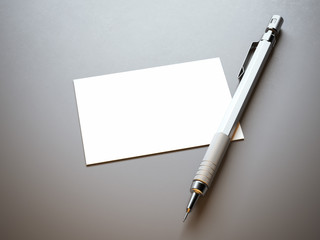 Blank white business card with pencil