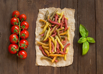 Tricolor pasta, vegetables, basil and cherry tomatoes
