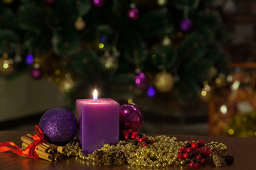 Candle and Christmas balls with winter decoration