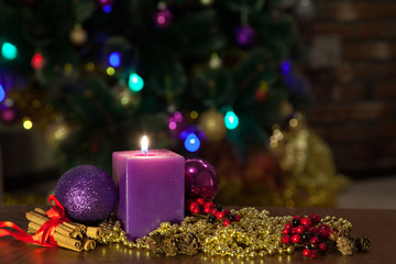 Candle and Christmas balls with winter decoration