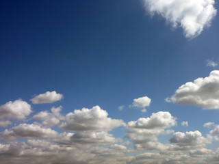 Clouds low on horizon in blue sky