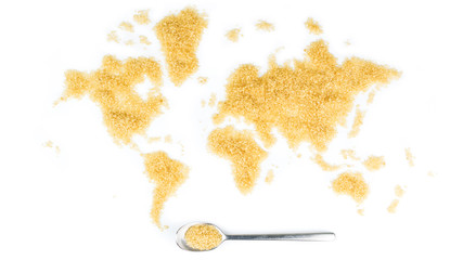 map of the world made of cane sugar with metallic spoon full of sugar