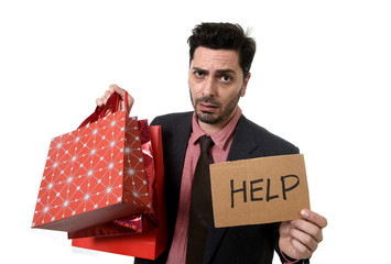 businessman holding shopping bags and credit card in worried and stress