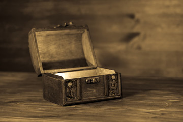 beautiful retro chest  on wooden background with place for text,
