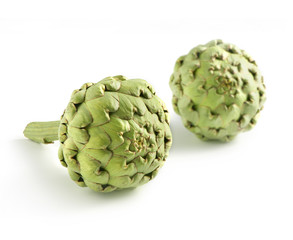 Obraz premium Two whole farm fresh artichokes