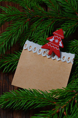 Fototapeta na wymiar Branch of Christmas tree and blank vintage paper