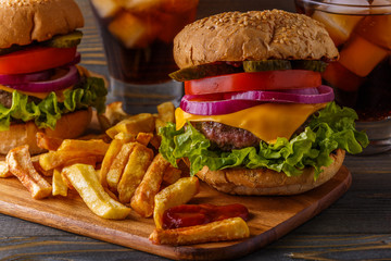 Burger, hamburger with french fries and fresh vegetables.