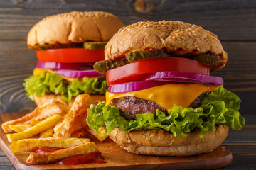 Burger, hamburger with french fries and fresh vegetables.