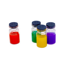 Four of pharmacy bottles with colored fluid. small transparent glass bottles with colorful medicinal content, isolated on white background